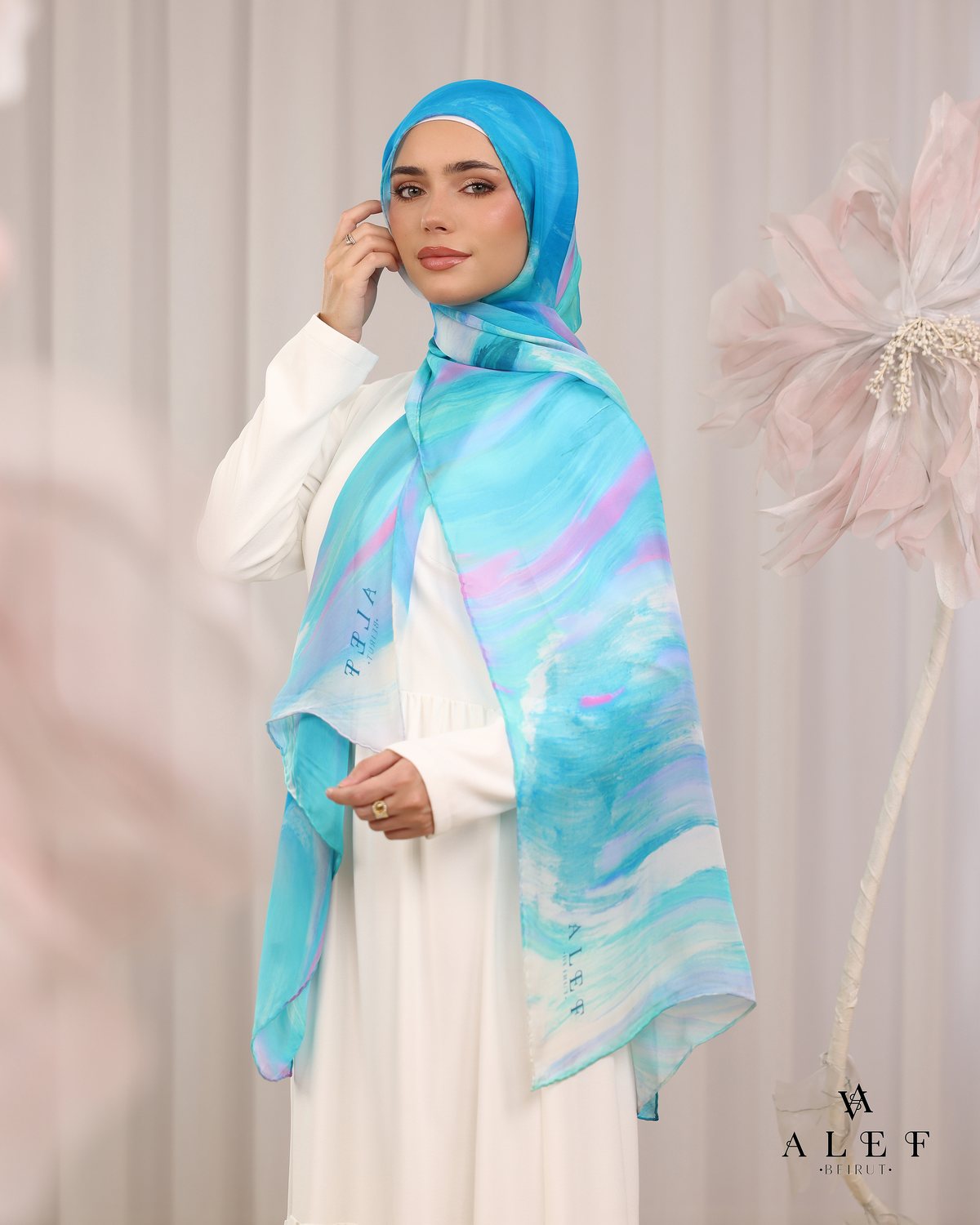 The Turquoise Lagoon silk scarf, on a white dress