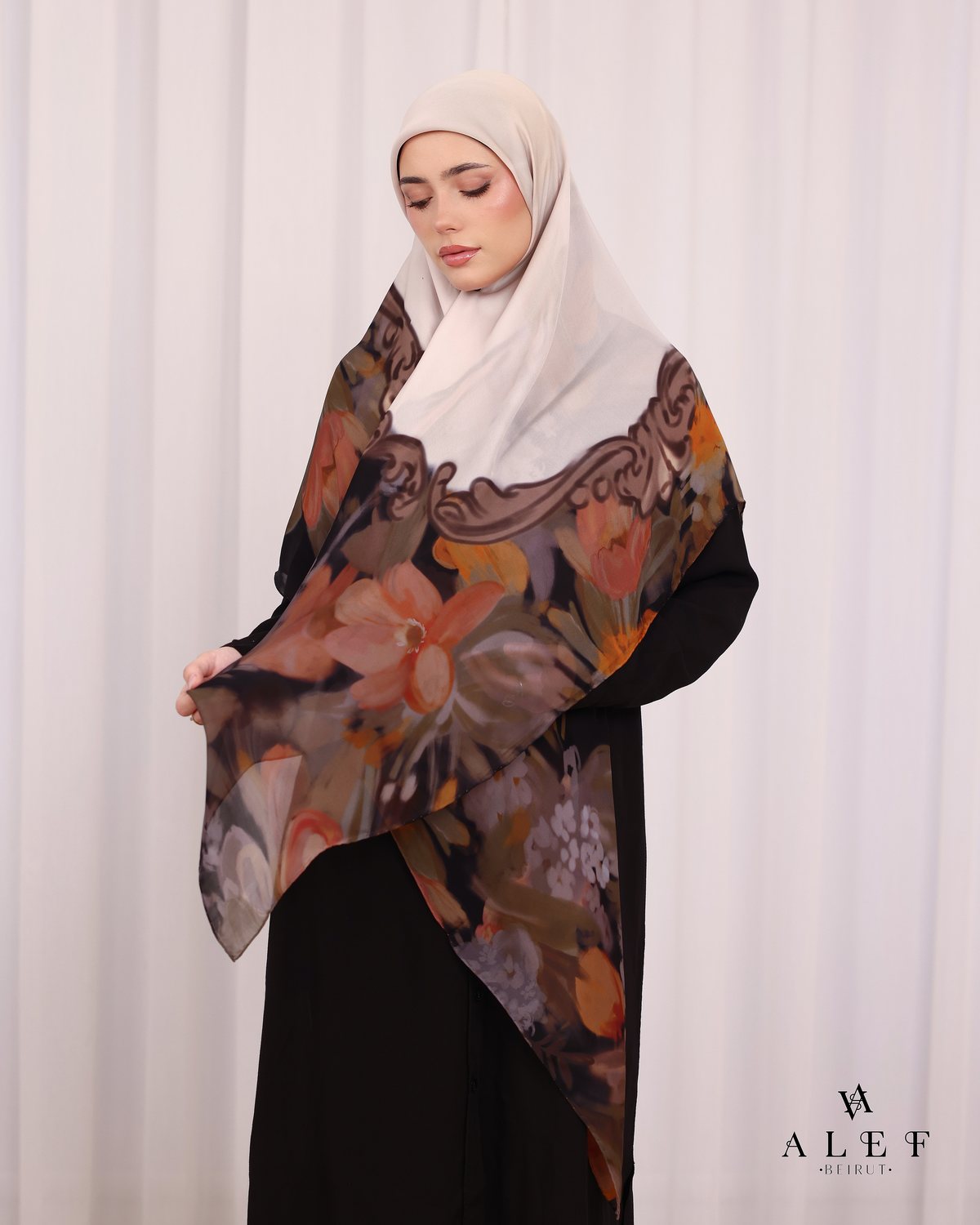 The Amber Baroque silk scarf, over a black abaya