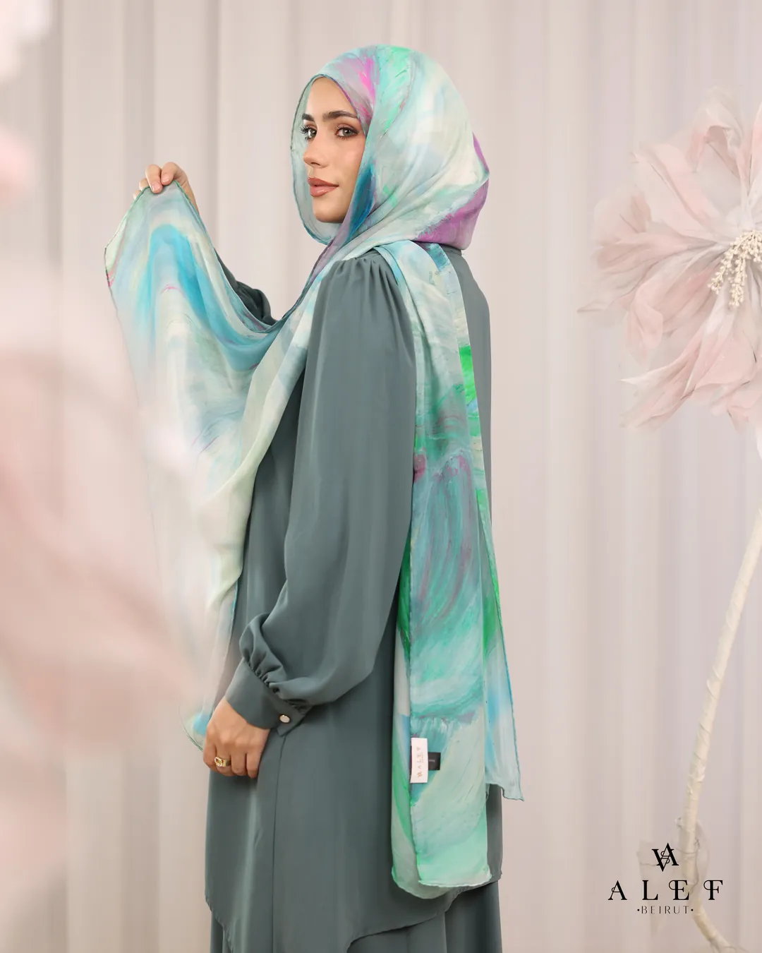 Pastel silk held open over sage